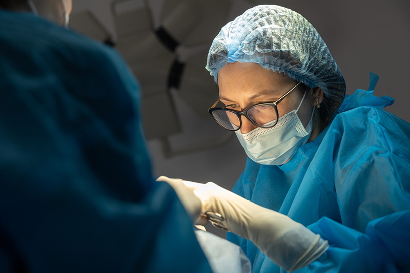 Surgeon preforming plastic surgery