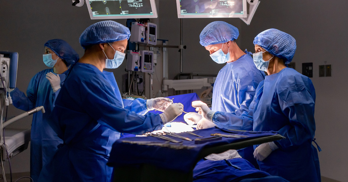 surgeons performing a surgery