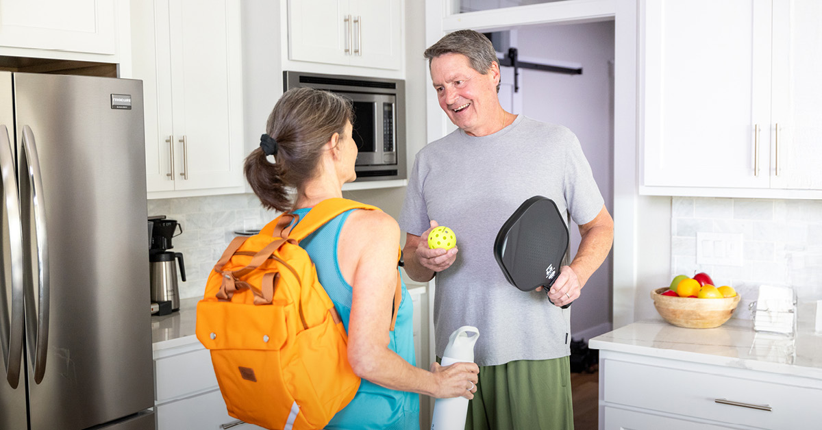man and wife discussing sports