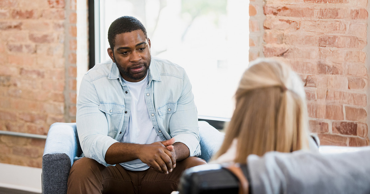 man in therapy appointment