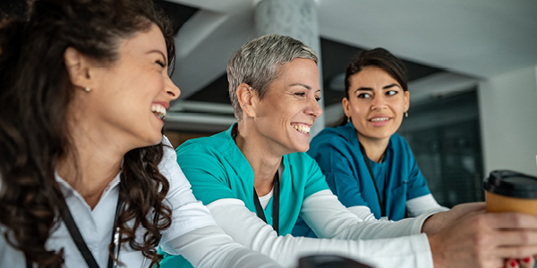 three women nurses talking