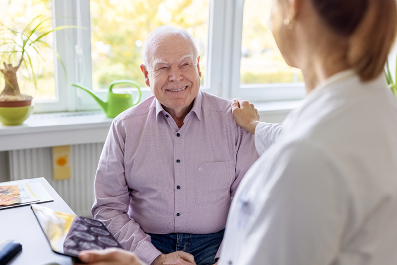 Older man talking to a doctor