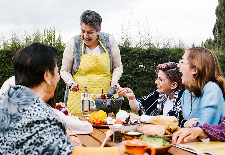 Several ladies at a barbecue picnic