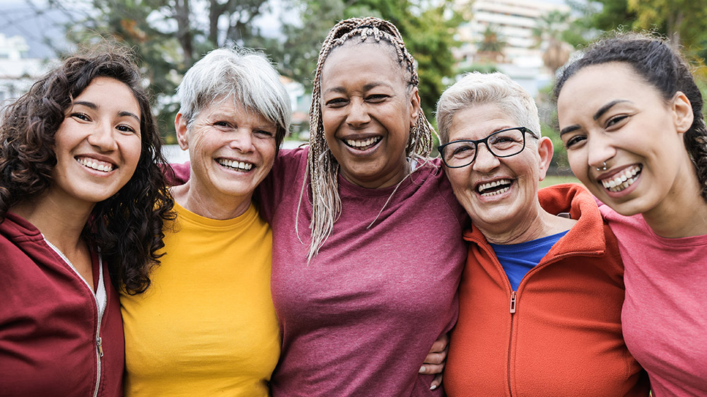 group of diverse females laughing